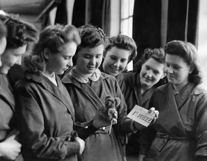Framed Print : World War II Home front: 14 year old Eileen Gearing shows some admiring rivals her 1st Framed Print : World War II Home front: 14 year old Eileen Gearing shows some admiring rivals her 1st