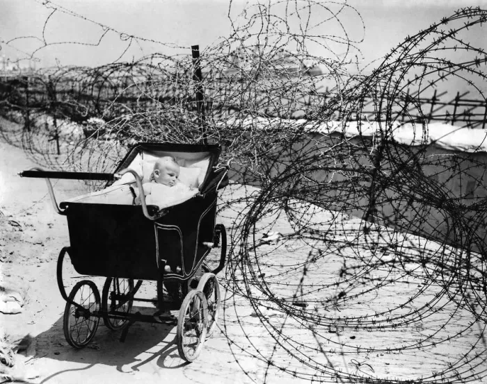 Framed Print : World War II: Home front. Baby enjoys the sea air as best she can Framed Print : World War II: Home front. Baby enjoys the sea air as best she can