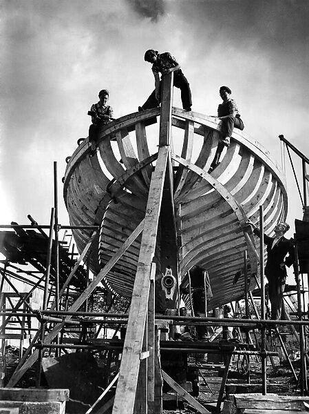 World War II: Ship Building. Women working on the stern of the seventh vessel to be built
