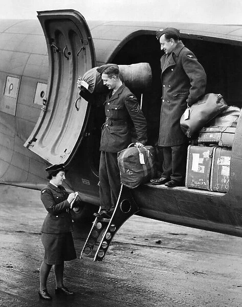 World War II Women. Two Airmen who have arrived from overseas being checked in by W. A. A. F