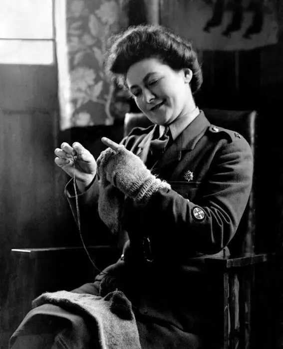Framed Print : World War II Women: Camp Romance. Private Dorothy Brownlow darns her husband socks Framed Print : World War II Women: Camp Romance. Private Dorothy Brownlow darns her husband socks