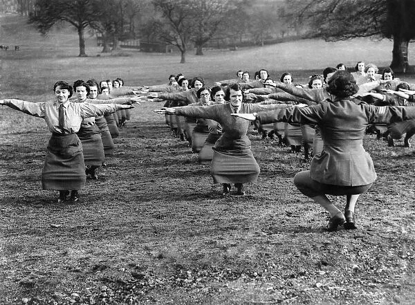 World War II. Women. Keep fit. The knees double bend is not so easy, as it appears