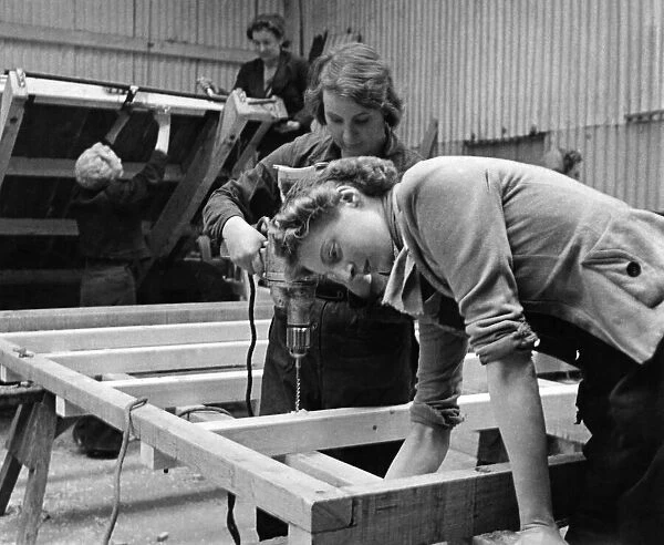 World War II Women: Girls make farm wagons at Gt. Yeldham, Essex