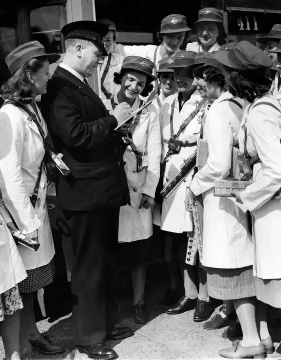 Framed Print : World War II Women: London transport - conductresses seen here reporting to the inspector