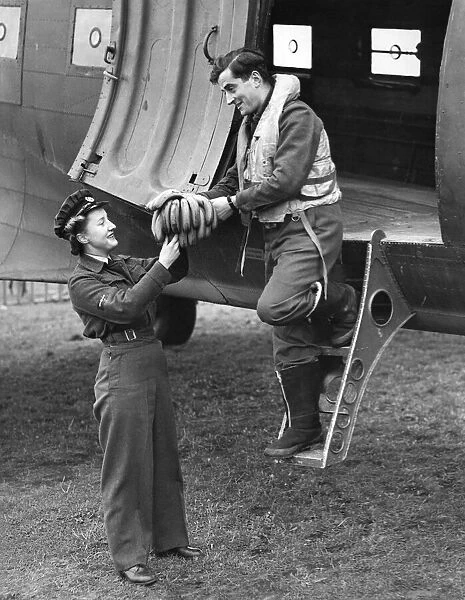 World War II Women. A pilot arriving from overseas to a Transport Command station handing