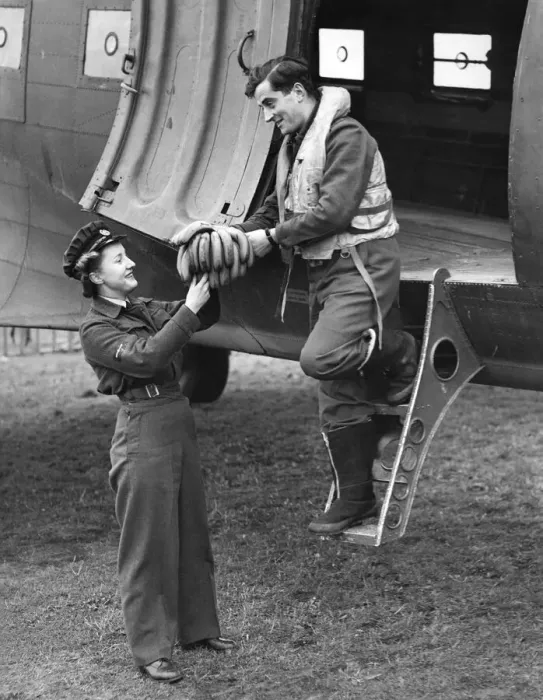 Framed Print : World War II Women. A pilot arriving from overseas to a Transport Command station handing Framed Print : World War II Women. A pilot arriving from overseas to a Transport Command station handing