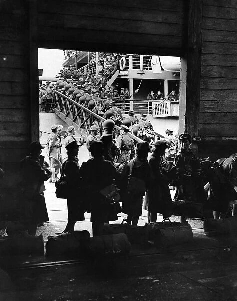 World War II: Women. A view through the shed at a British Port when the largest