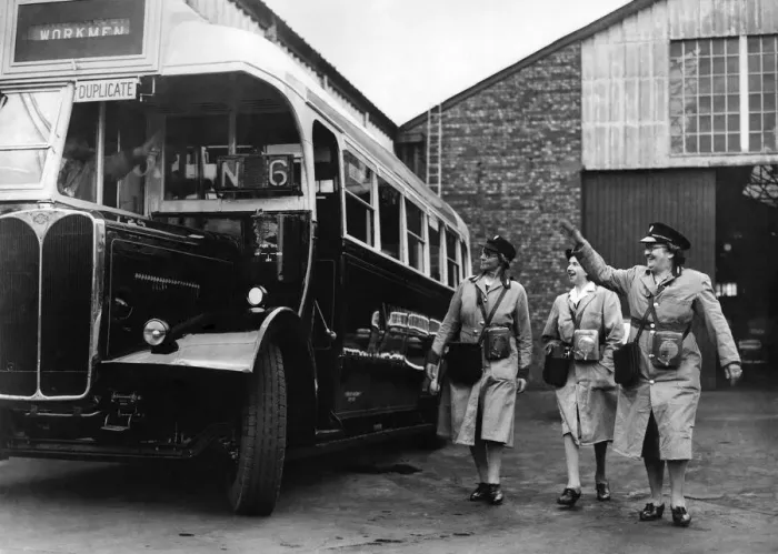 Framed Print : World War II Women: Women conductress arrive for work at a Northern English town bus
