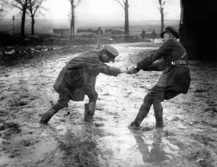 Framed Print : World War One. A British officer helps a fellow officer who Framed Print : World War One. A British officer helps a fellow officer who