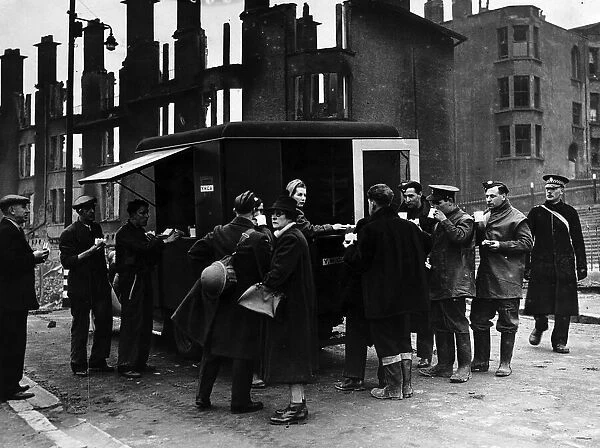 World War Two - Rescue workers relax at a mobile canteen amid the ruins of Clydeside