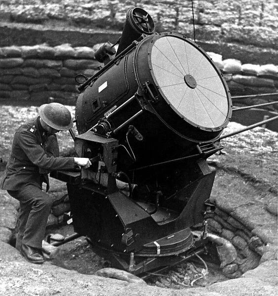 World War Two - Second World War - A searchlight is overhauled before nightfall at an