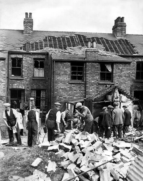 World War Two - Second World War - Workmen deal with the results of a German air raid