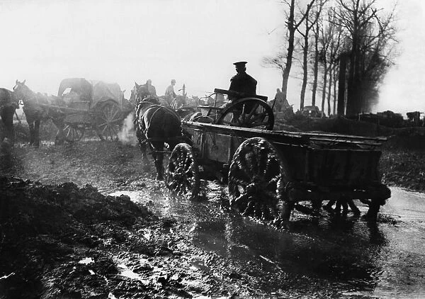 World War One - A soldier drives a horse and supply cart through water logged fields