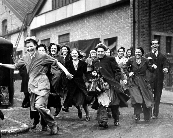 World War Two. Factory girls at a well known London electrical firm race to be first