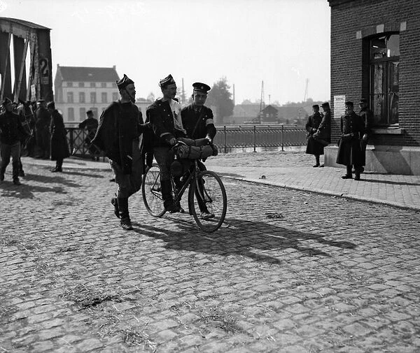 Though wounded this Belgian soldier could bicycle with a little assistance from his