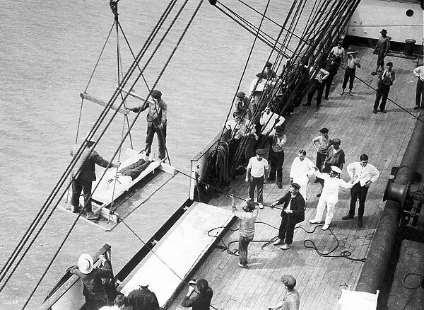 Wounded British soldiers are taken on board the hospital ship Pegasus, November 1914