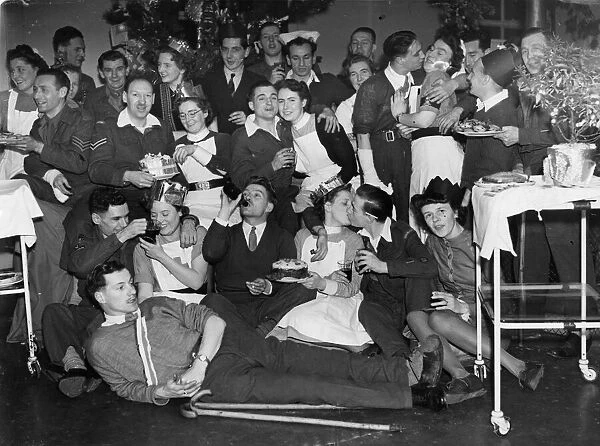 Wounded servicemen enjoy a Christmas meal and party held for them by nurses