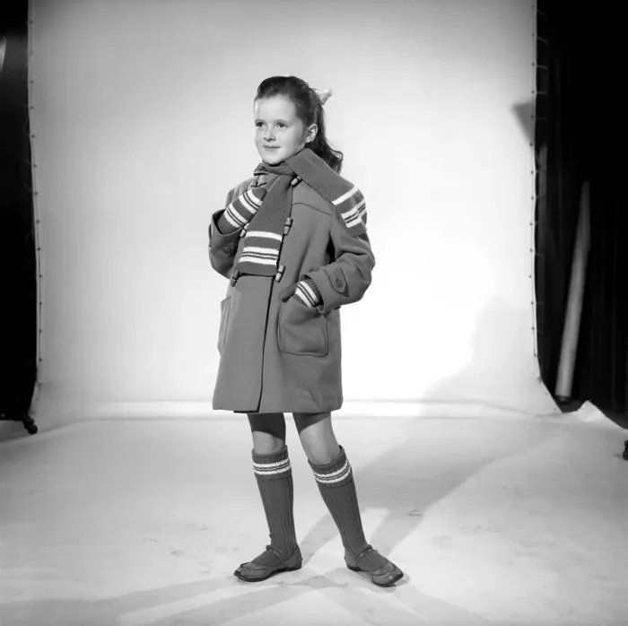 Framed Print : Wrap up for winter: School girl wearing winter coat, scarf and socks. November 1956 B591 Framed Print : Wrap up for winter: School girl wearing winter coat, scarf and socks. November 1956 B591