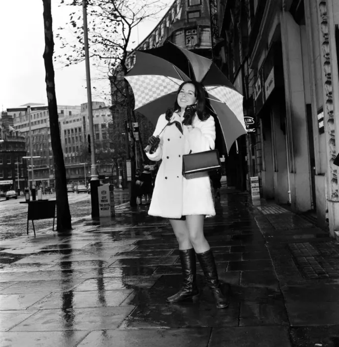 Framed Print : Wrapped up warn and dry for the cold wet London weather, Miss Canada Framed Print : Wrapped up warn and dry for the cold wet London weather, Miss Canada