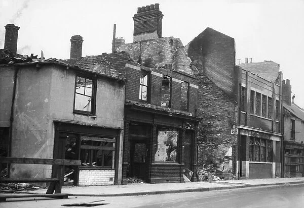 Wrecked and burnt out shops on Lombard Street, Hull following a raid on the centre of