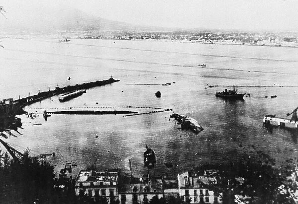 Wrecked enemy shipping in the harbour at Castellammare in the Bay of Naples