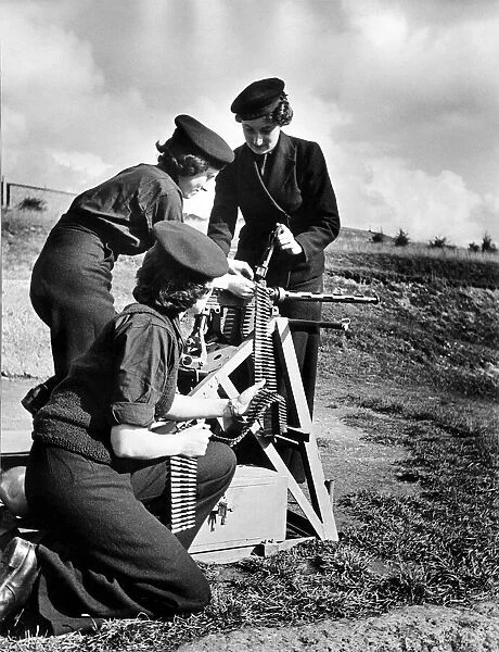 There are now wrens as Armourers and Picture shows them at work on Turret Gun before they
