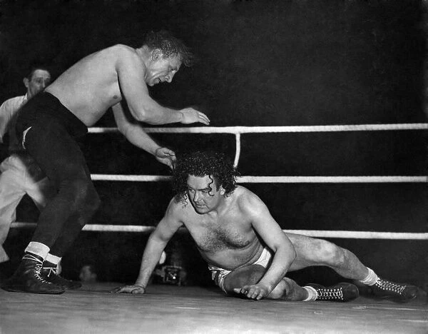 Wrestling match at Harringay. Jack Doyle in white trunks in action against Eddie Phillips