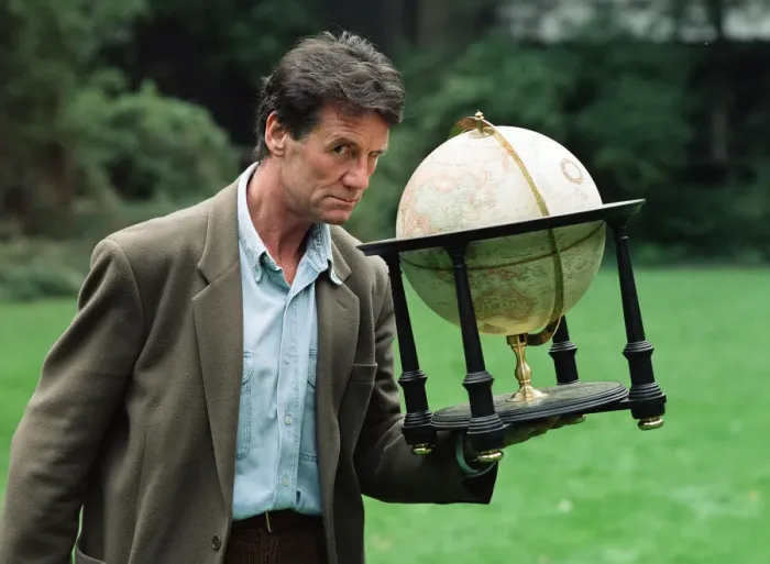Framed Print : Writer and actor Michael Palin with a globe. 8th October 1992