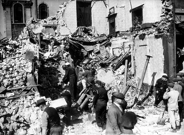 WW2 Air Raid Damage Bomb damage in Cardiff - people survey the wreckage