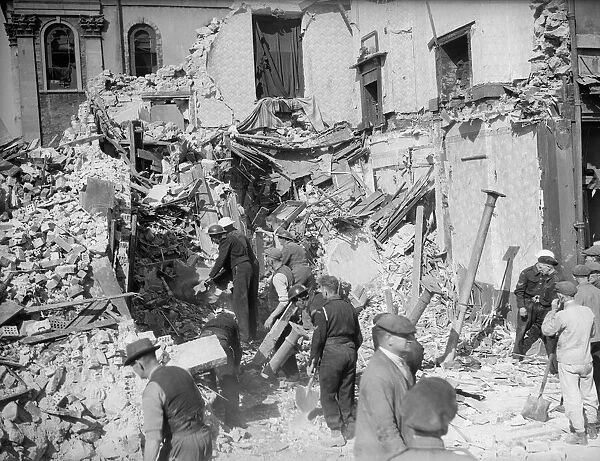 WW2 Air Raid Damage Bomb damage in Cardiff - people survey the wreckage