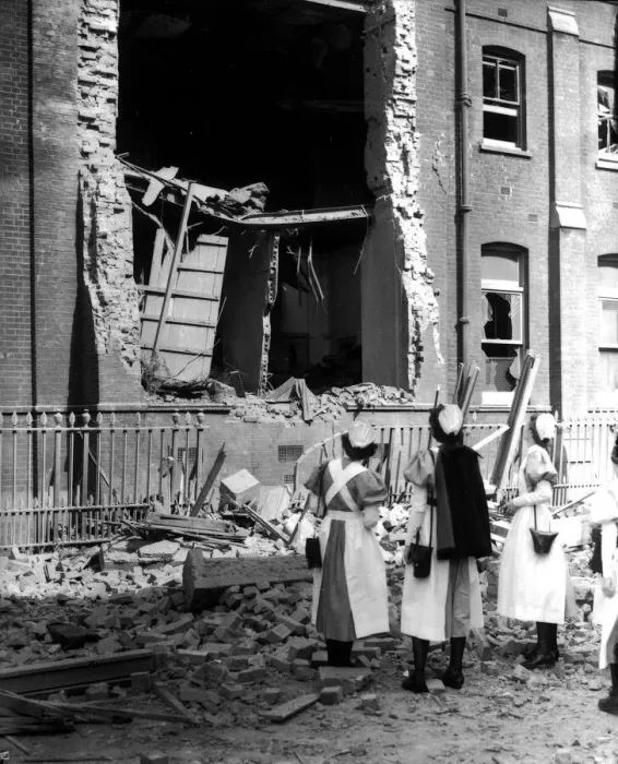 Framed Print : WW2 Air Raid Damage Nurses looking at a bombed hospital building during the blitz Framed Print : WW2 Air Raid Damage Nurses looking at a bombed hospital building during the blitz