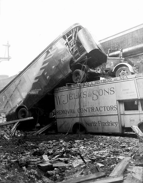 WW2 Air Raid Damage Removal company trucks sit on top of one another after a raid