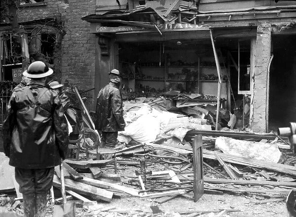 WW2 Air Raid Damage Rescue workers at a bombed site after during blitz