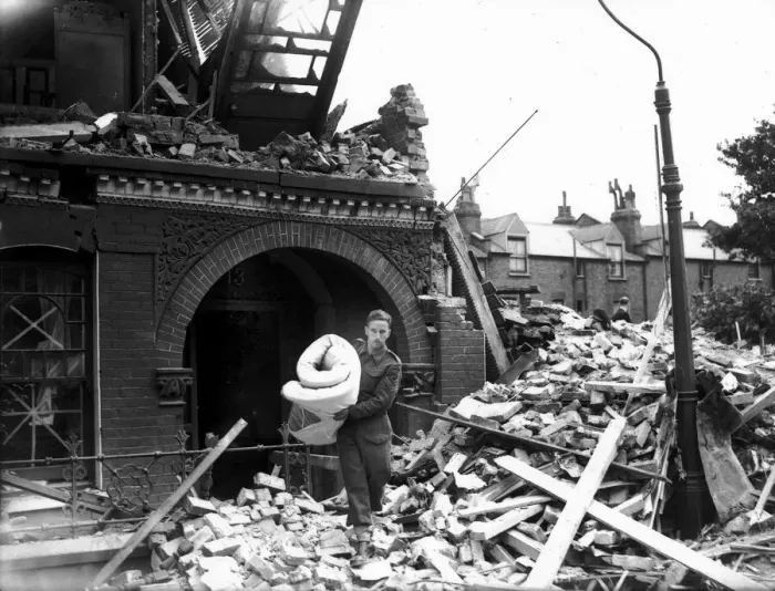 Framed Print : WW2 Air Raid Damage Tooting Bomb damage at Tooting London A soldier carries Framed Print : WW2 Air Raid Damage Tooting Bomb damage at Tooting London A soldier carries