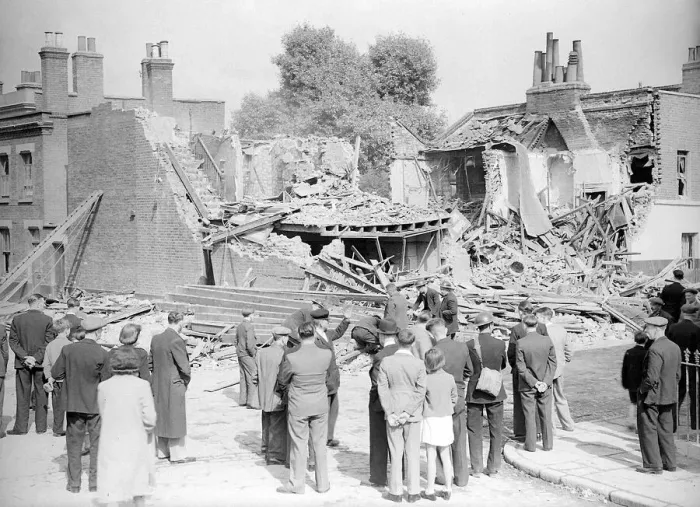 Framed Print : WW2 The Blitz Bomb damage in London Local residents stop to look at bomb Framed Print : WW2 The Blitz Bomb damage in London Local residents stop to look at bomb
