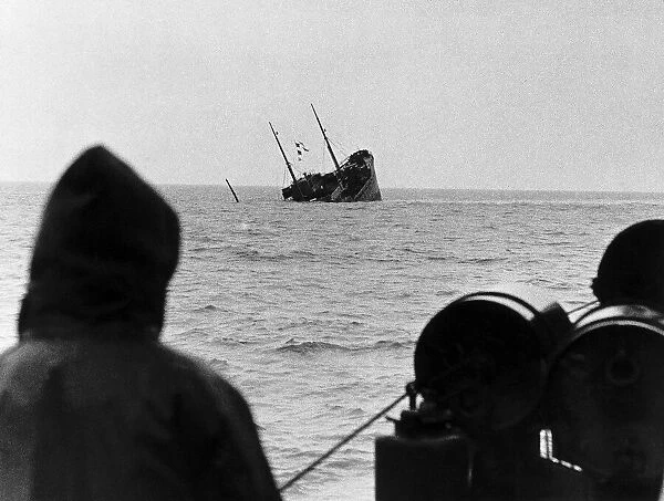 WW2 A British corvette sinks below the waves after hitting a mine dropped in