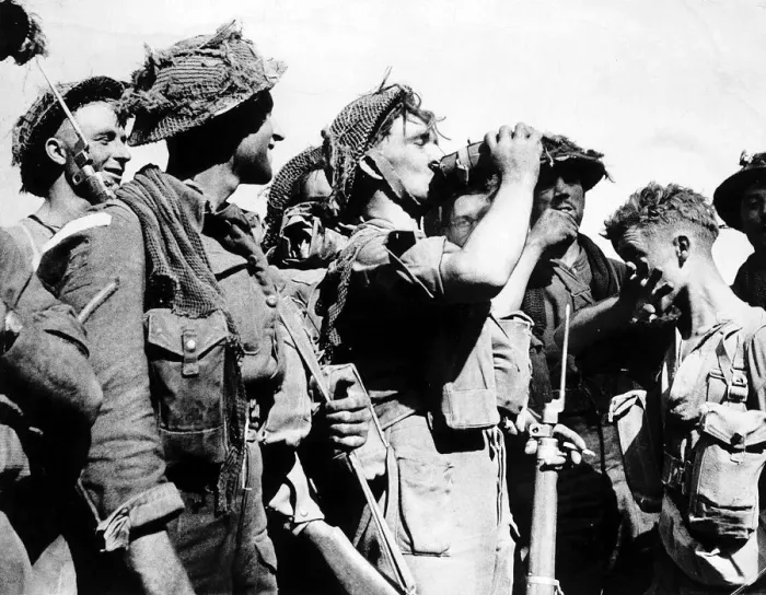 Framed Print : WW2 British soldier drinks from his waterbottle 1944