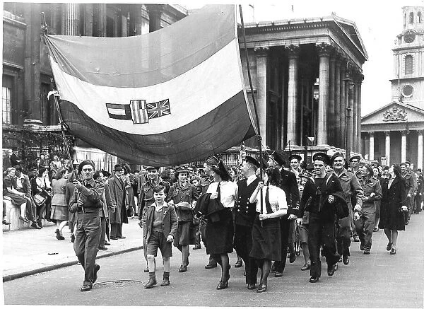 WW2 Members of the Canadian English American and Norwegian forces march around Trafalgar