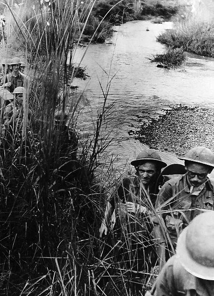 WW2 patrol advancing through the rushes on their way to Mohnyin