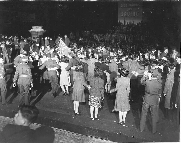 WW2 People dancing in Trafalgar Square London during VE Day celebrations May 1945