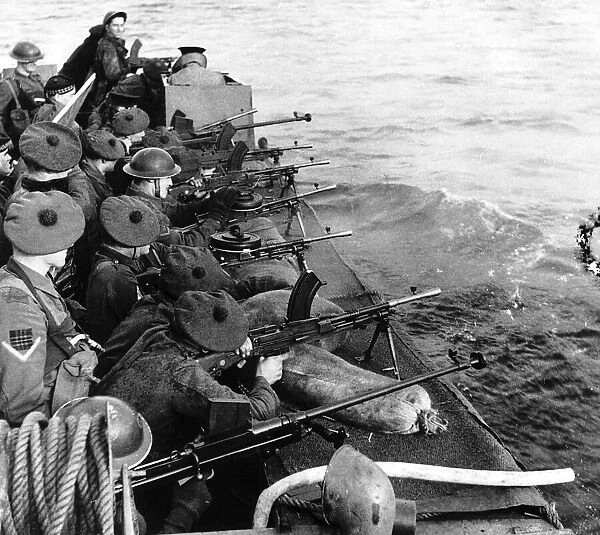 WW2 - Scottish soldiers, firing bren guns out to sea from their landing craft