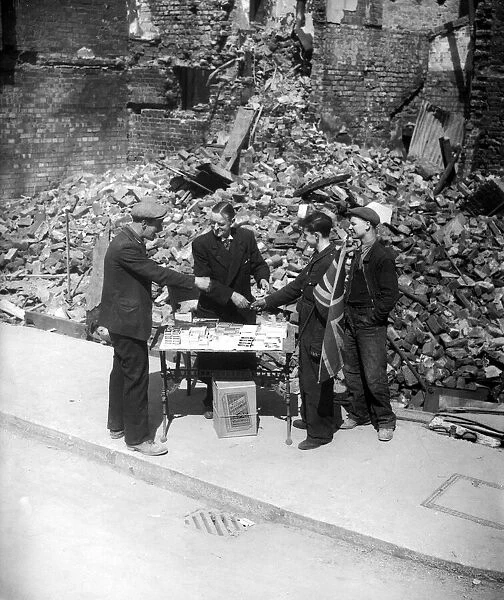 WW2 Tobaconist sales cigarette outside his bombed shop