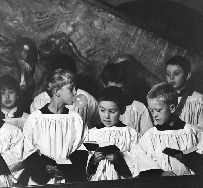 Framed Print : Ten year old choirboy Ian Stacey of Bethnal Green tries to break the concentration of his Framed Print : Ten year old choirboy Ian Stacey of Bethnal Green tries to break the concentration of his