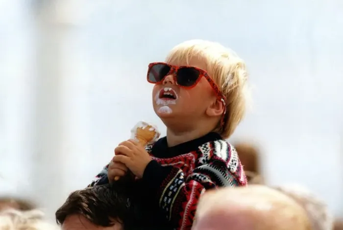 Framed Print : Two year old Craig Emmerson enjoys an ice cream whist watching an air display