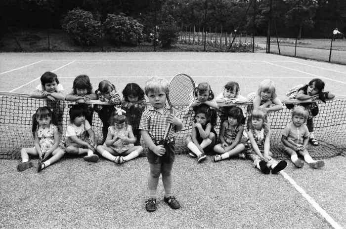 Framed Print : Three year old Daniel Jarmin holds a tennis racket as he poses with other friends in his