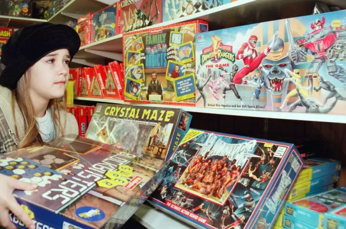 Framed Print : Nine year old Gemma Coakley from Easterside checks out the latest games from Telly