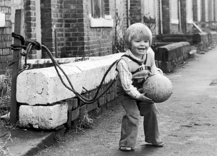 Framed Print : Two year old Jeffrey Metcalfe who has nearly been run over several times is now tied up Framed Print : Two year old Jeffrey Metcalfe who has nearly been run over several times is now tied up