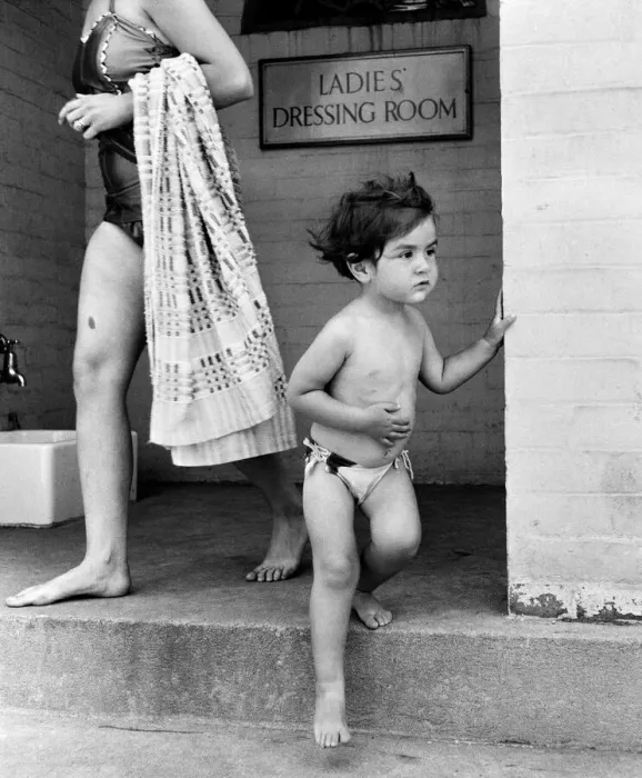 Framed Print : Two year old Judith Fisher comes out of the ladies dressing room to go for a swim