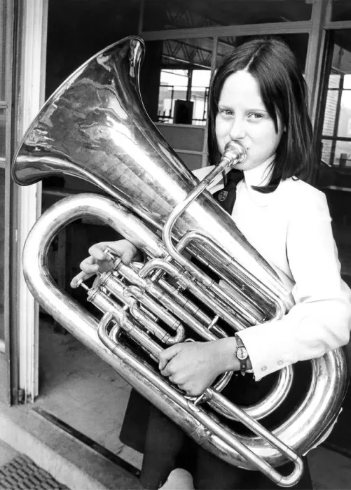 Framed Print : Nine year old Pamela Henderson rehearsing her part with her E-flat Bass Tuba in Framed Print : Nine year old Pamela Henderson rehearsing her part with her E-flat Bass Tuba in