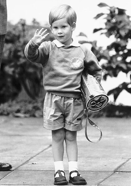 Three year old Prince Harry waves to the waiting croud on his first day at the nursery
